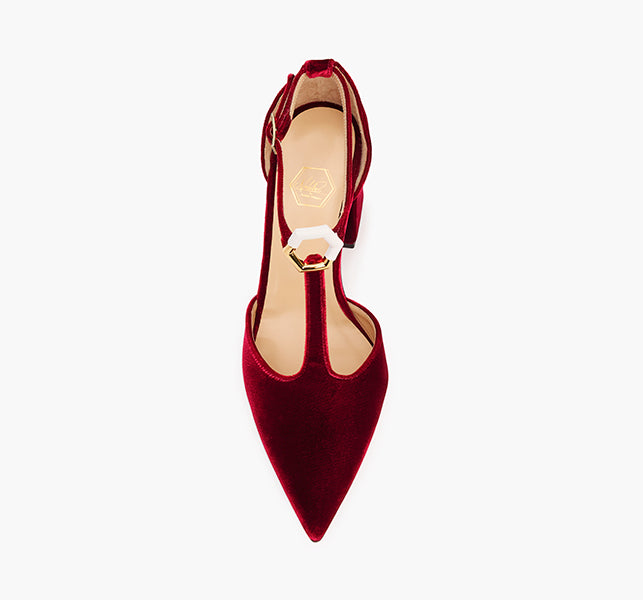 Designer red pumps with mixed-metal hexagon detail
